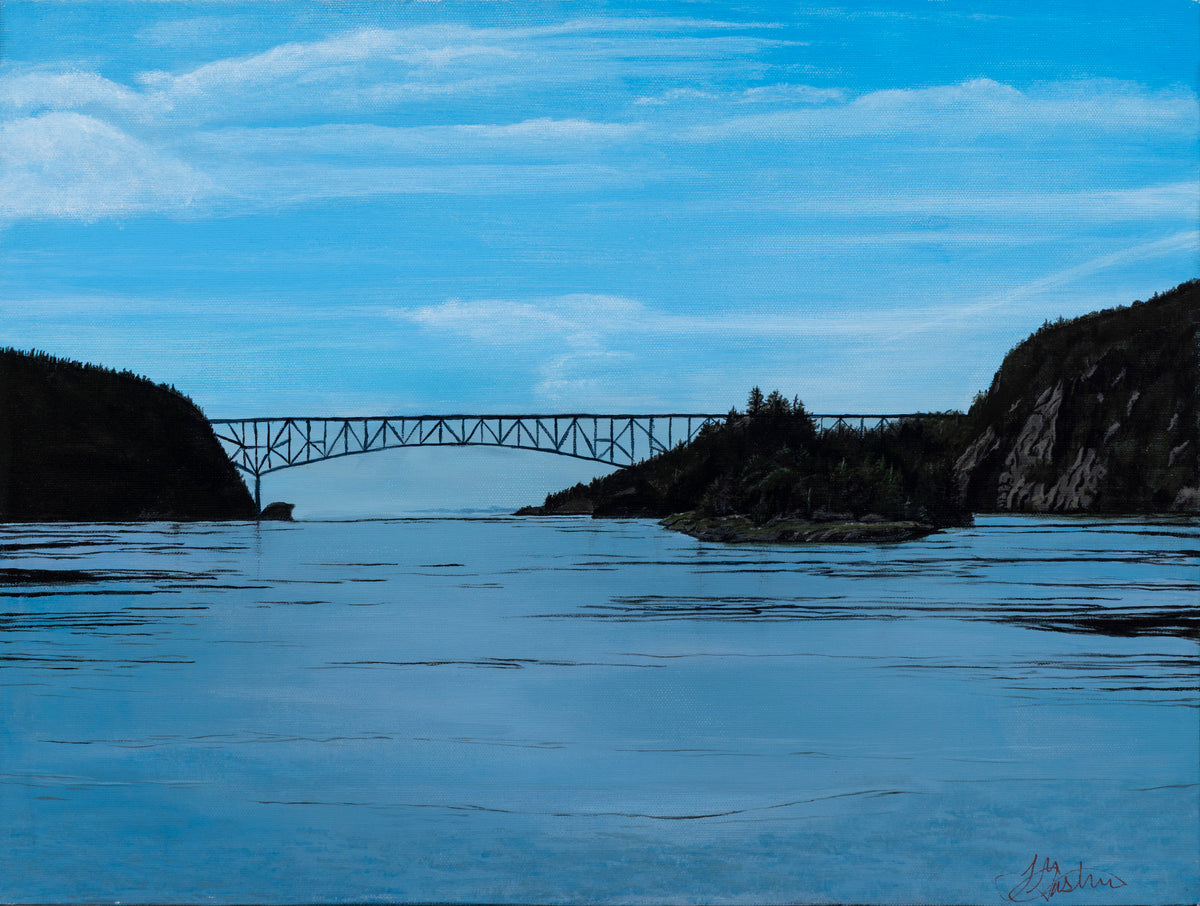 Bridge over a calm body of water with rocky cliffs on either side. Landscape depicting a different vantage viewpoint of Deception Pass, connection Whidbey Island to the mainland of Skagit County, WA.